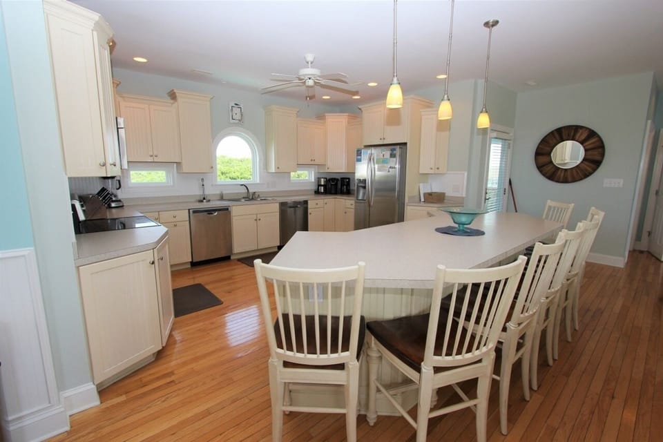 Your spacious kitchen features granite counters, stainless appliances, and a large island perfect for family meals and entertaining.