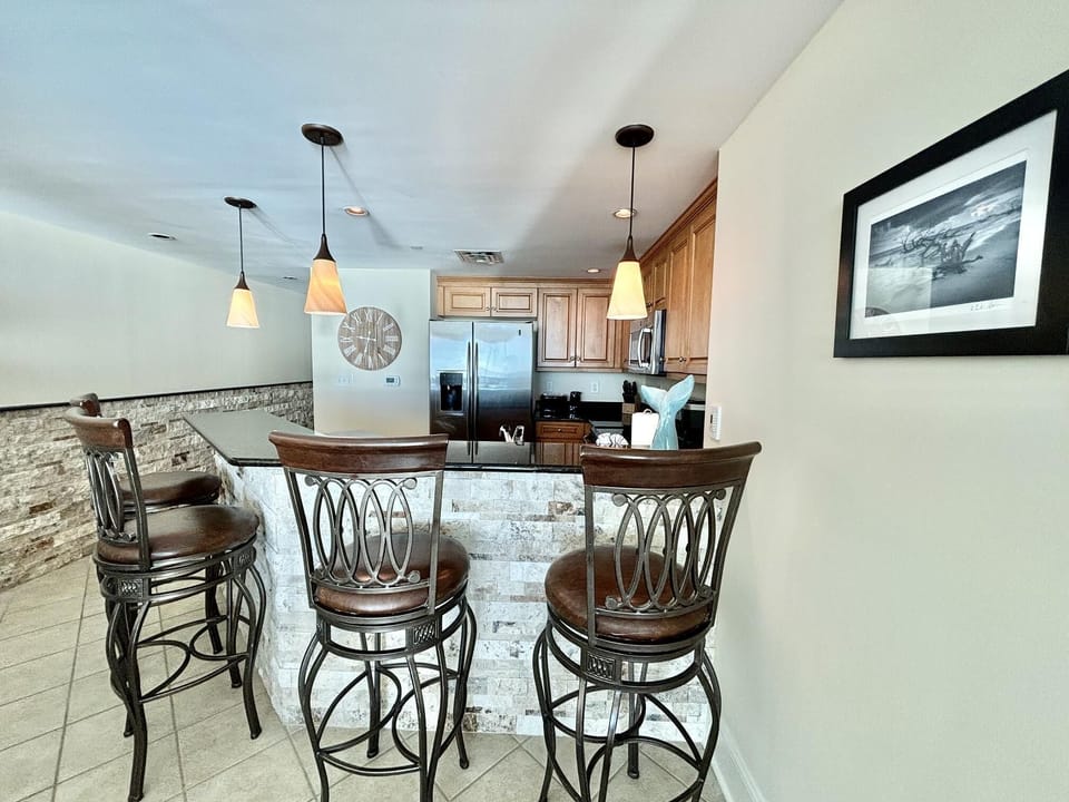 Bright, open kitchen with bar seating for lively gatherings