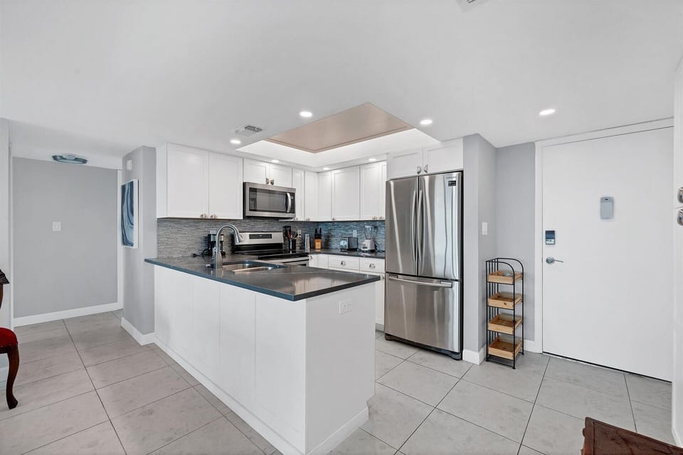Beautifully updated, fully-equipped kitchen overlooking living room/dining room