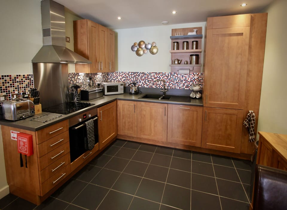 Updated kitchen with tiling and shelves