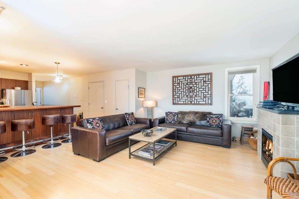 Living room with two couches and tv at this Telluride condo for rent.
