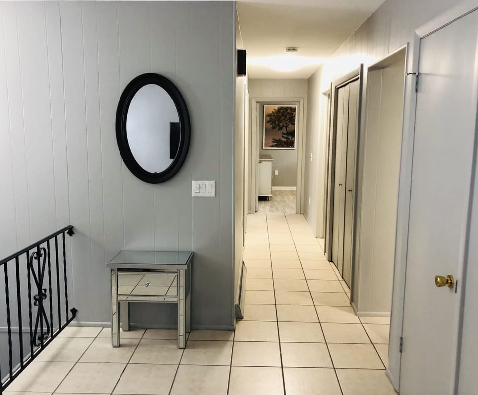 living room hallway into 3 main level bedrooms and full bathroom