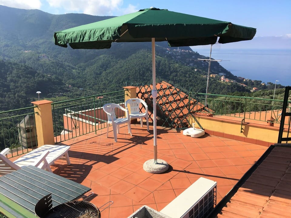 Sky, Property, Shade, Outdoor Furniture, Cloud, Wood, Mountain, Leisure, Urban Design, Landscape