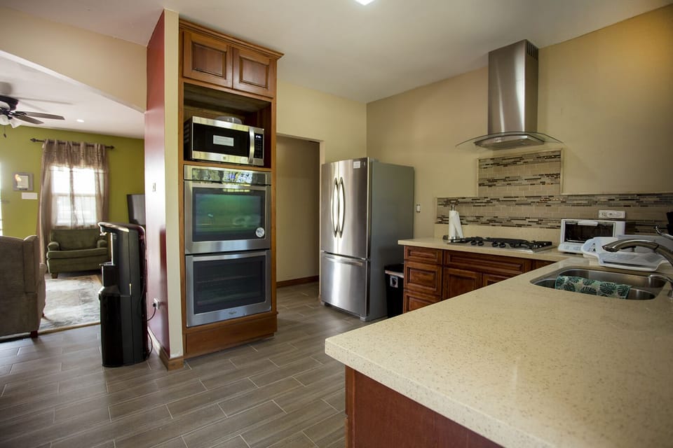 Spacious, modern kitchen with new stainless steel appliances.