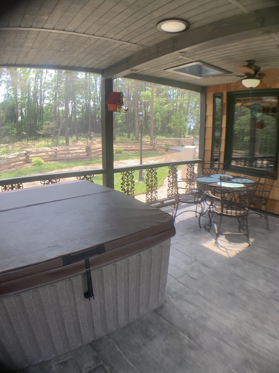 hot tub screened in porch seating area