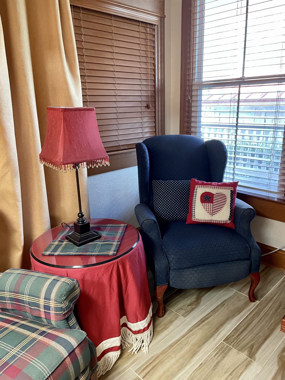 Two upholstered chairs in small sitting area in bedroom.