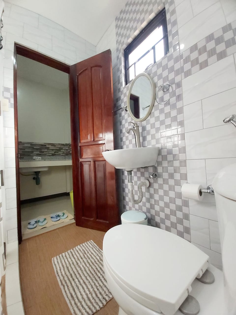 Shower, rainfall showerhead, hair dryer (on request), slippers