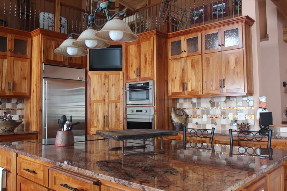 Gourmet kitchen with stainless steel appliances, and center island.