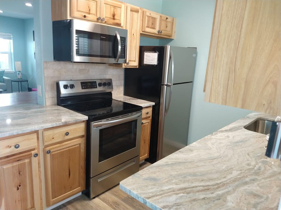 Stove, Refrigerator, and Microwave in the kitchen.