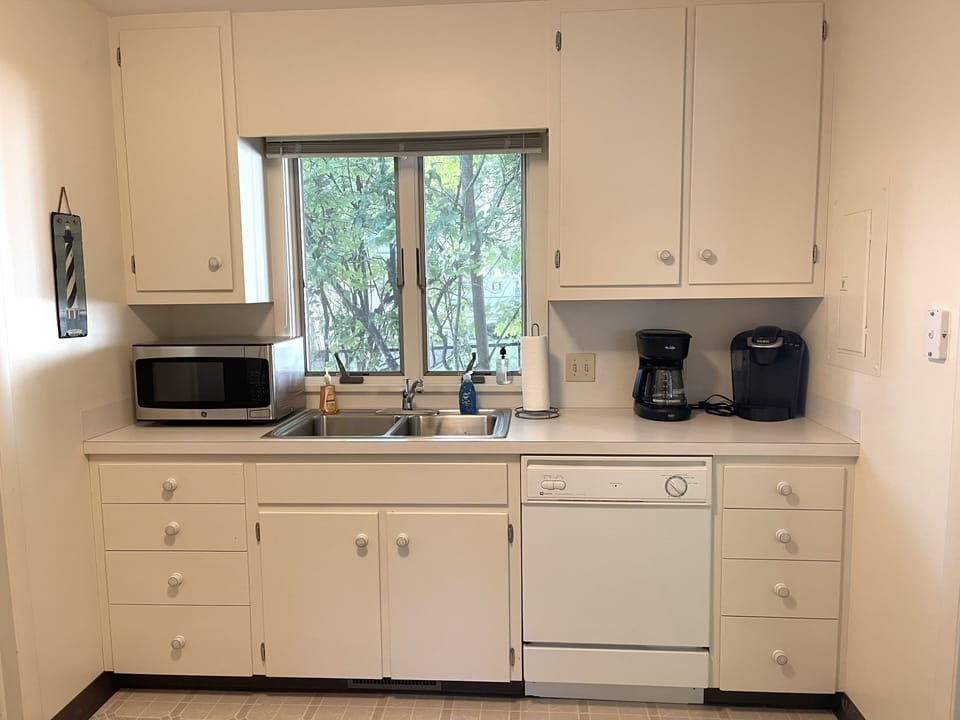 The kitchenette is located closer to the large family room and outside deck.