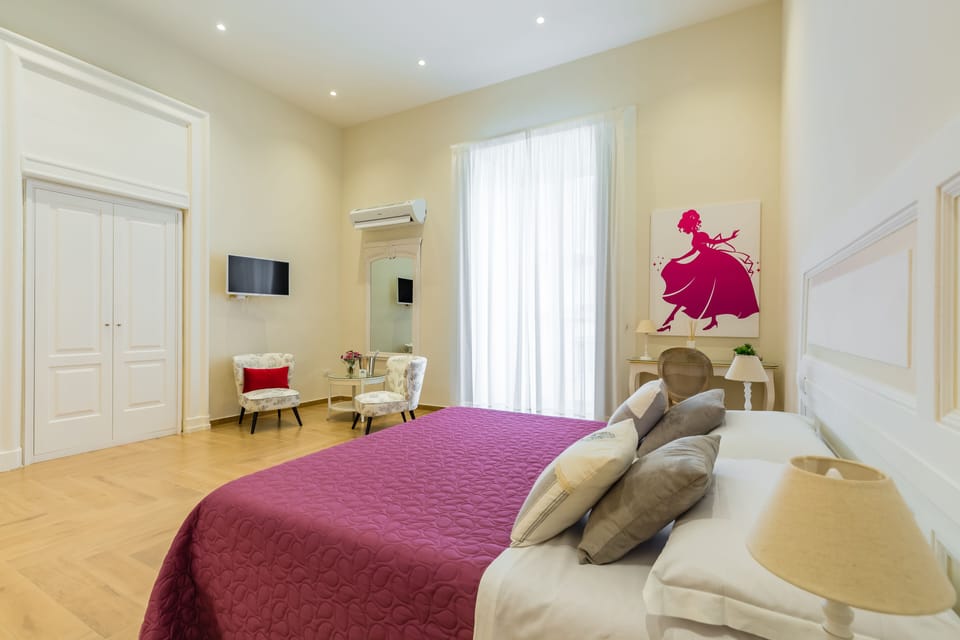 Luxury Triple Room (Suite La Gatta Cenerentola) | Individually decorated, individually furnished, desk, laptop workspace
