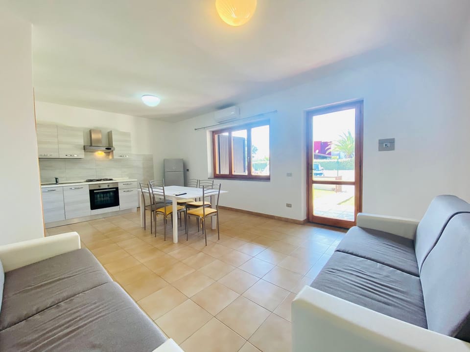 Apartment, 2 Bedrooms | Living area | 22-inch TV with digital channels