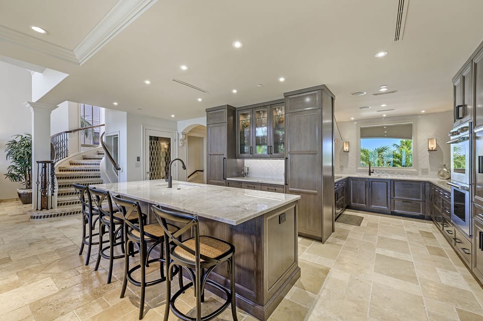 Large Island with ice maker behind for beverage center.