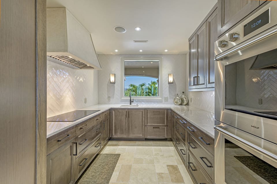 Double oven, cook top w/stone exhaust above, sink and double drawer dishwasher!