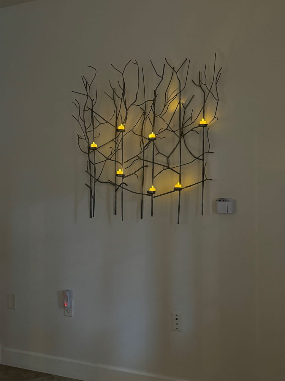 Wall sculpture illuminated in evening