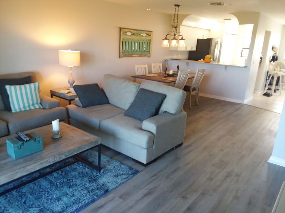 Living room view to dining and kitchen