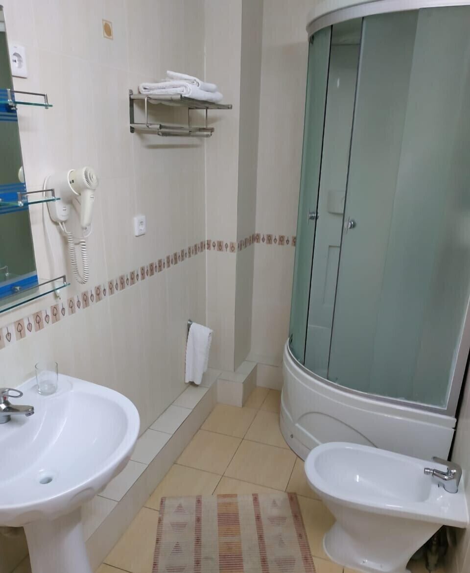 Shower, slippers, bidet, towels
