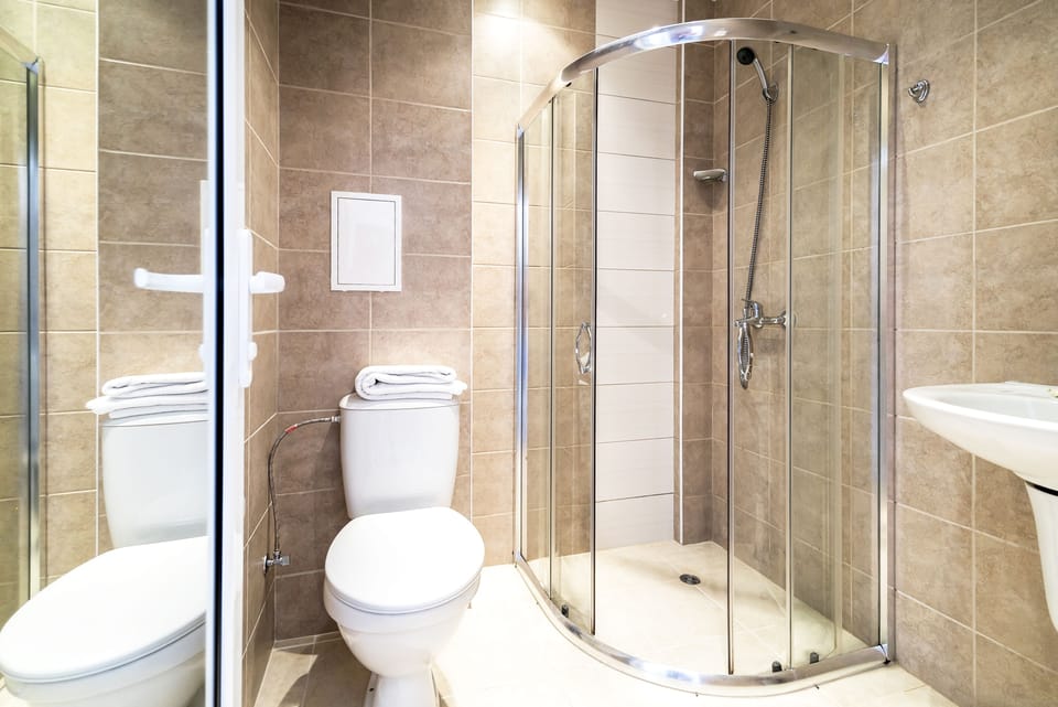 Family Studio, Balcony | Bathroom | Shower, free toiletries, hair dryer, towels