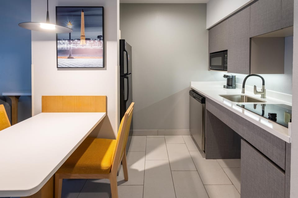 Suite, 1 King Bed, Accessible | Private kitchen | Fridge, microwave, stovetop, dishwasher