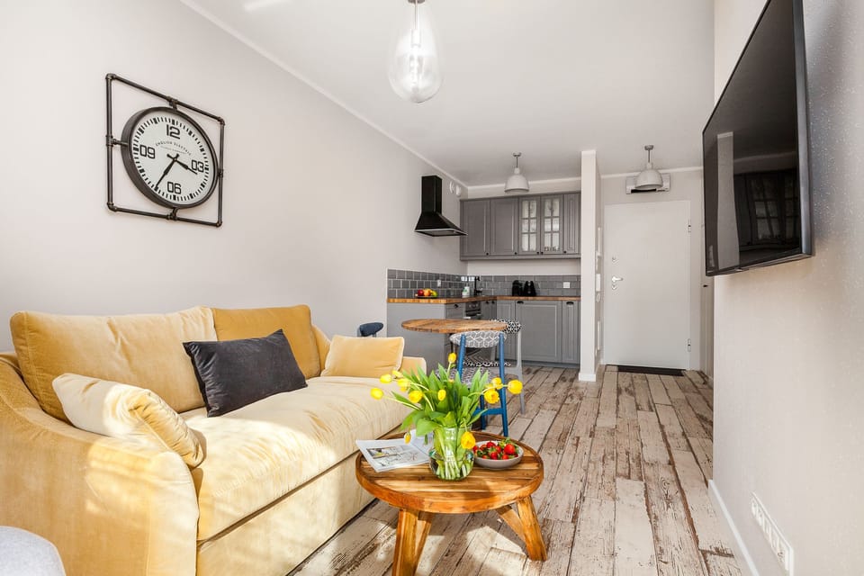 Design Apartment, City View | Living area | 55-inch flat-screen TV with cable channels, TV