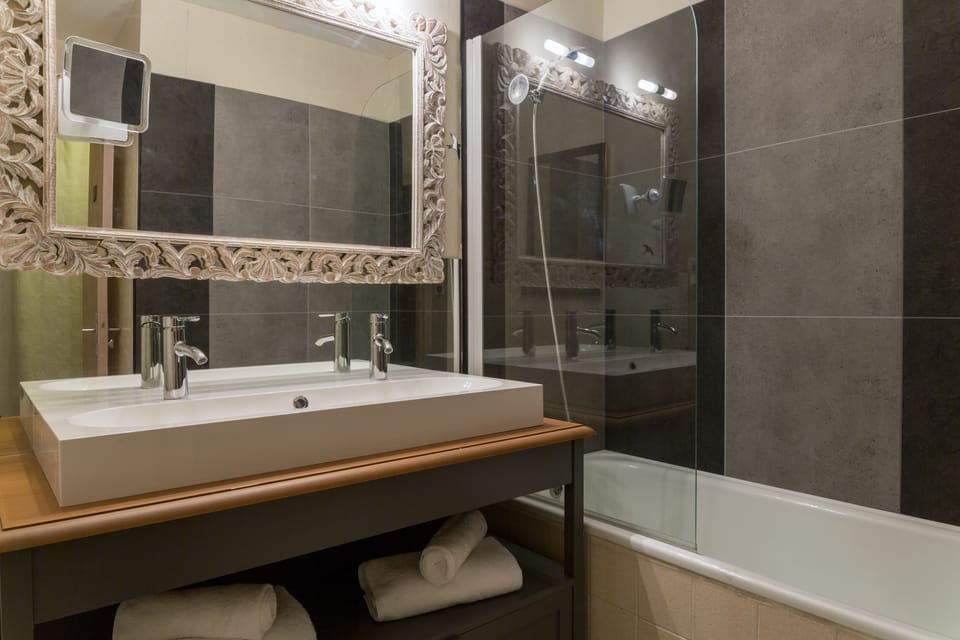 Bathtub, hair dryer, towels, soap