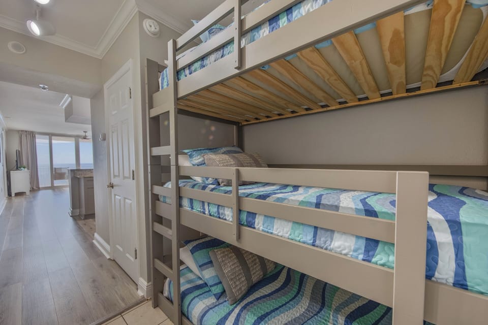 Triple bunkbed in the hallway nook
