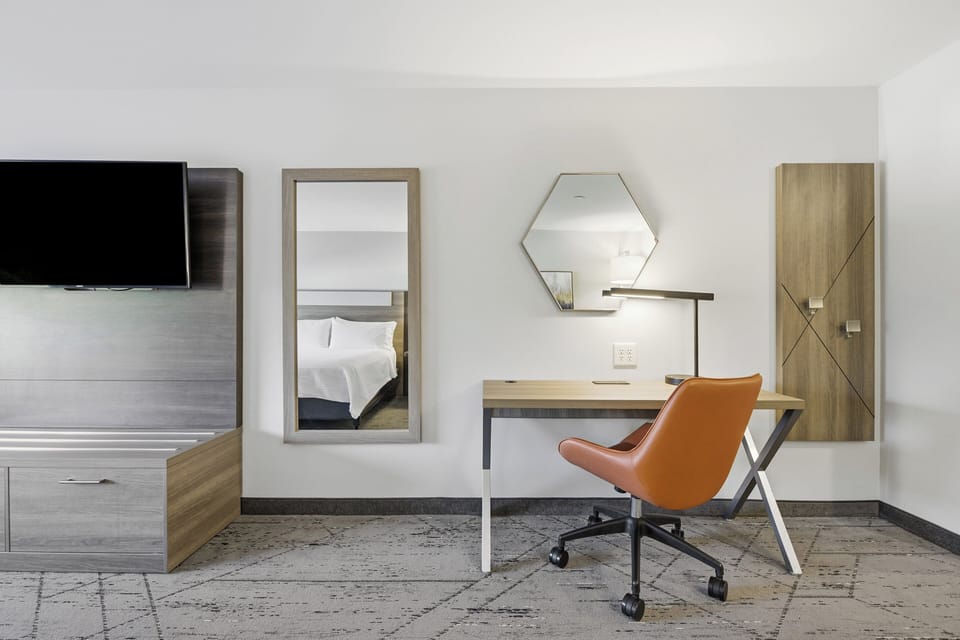 Down comforters, pillowtop beds, in-room safe, desk