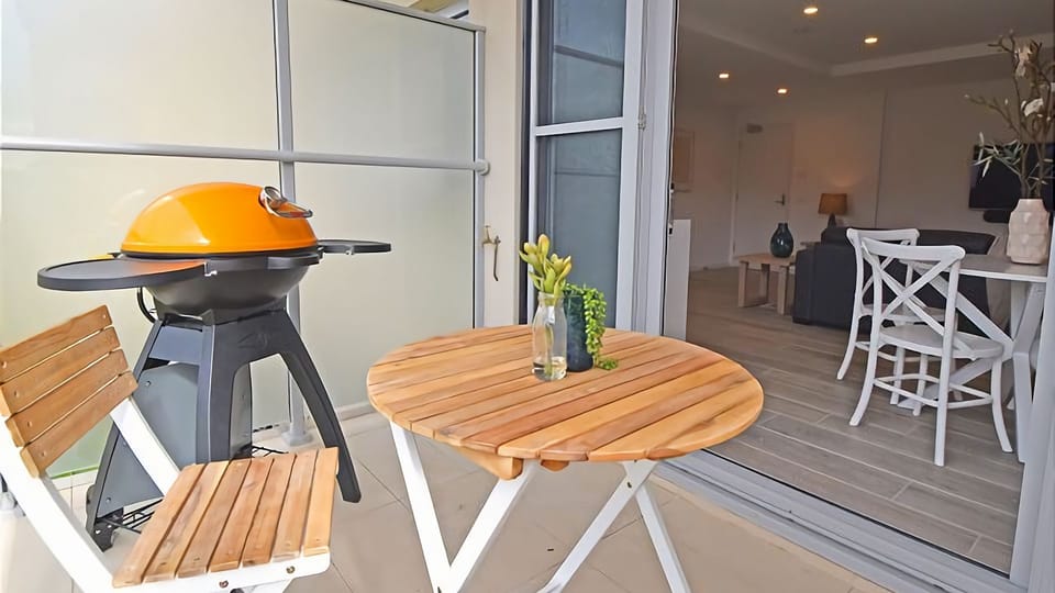 Relax and unwind on your private balcony with BBQ and outdoor setting.