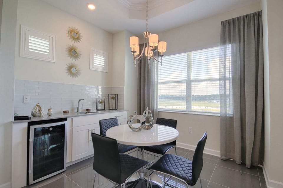 Wet Bar Alcove Features Wine Fridge, Sink w/Cabinet Space, Seating for 4 and Glorious Penthouse View
