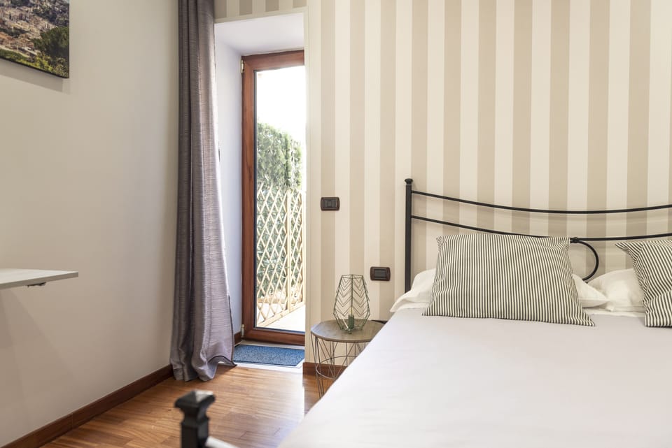 Comfort Room, 1 Queen Bed (Room 45 - O' Vino Buono) | Individually decorated, individually furnished, desk, blackout drapes