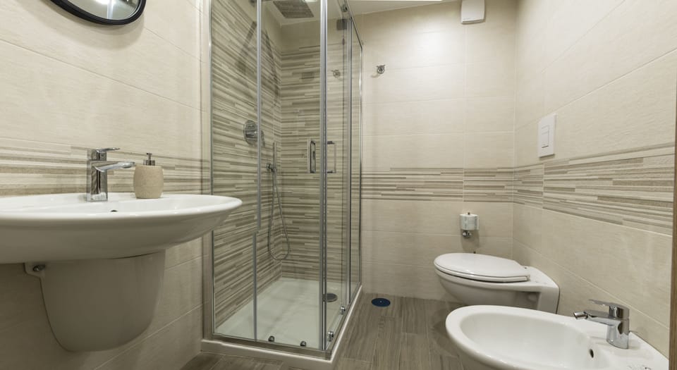 Comfort Room, 1 Queen Bed (Room 19 - A' Resata) | Bathroom | Shower, free toiletries, hair dryer, slippers
