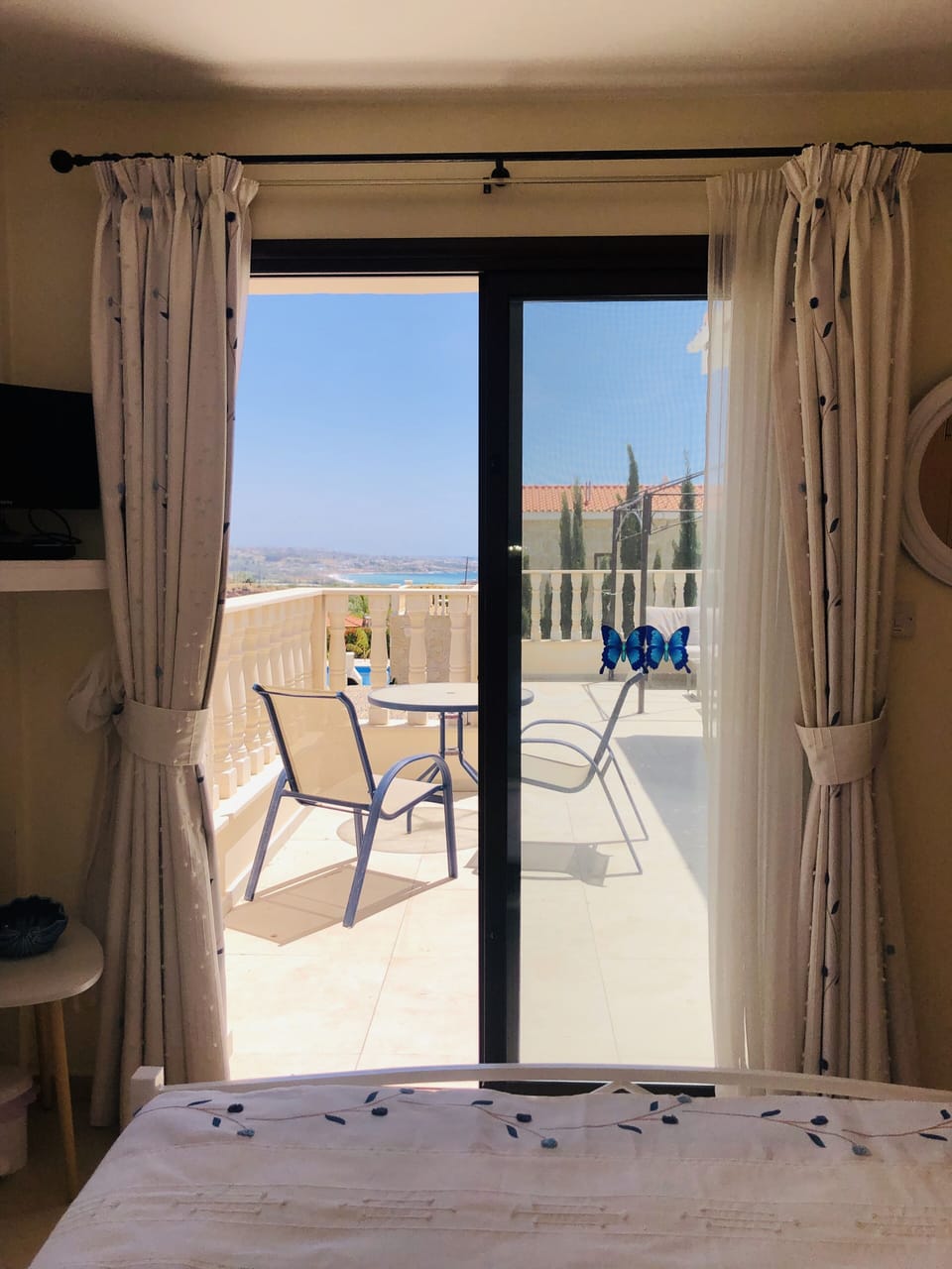 King bedroom (upper floor) with doors out to roof terrace & air conditioning