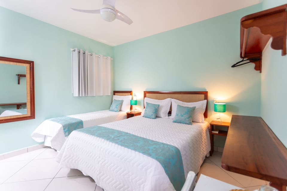Triple Room | Minibar, blackout drapes, free WiFi, bed sheets
