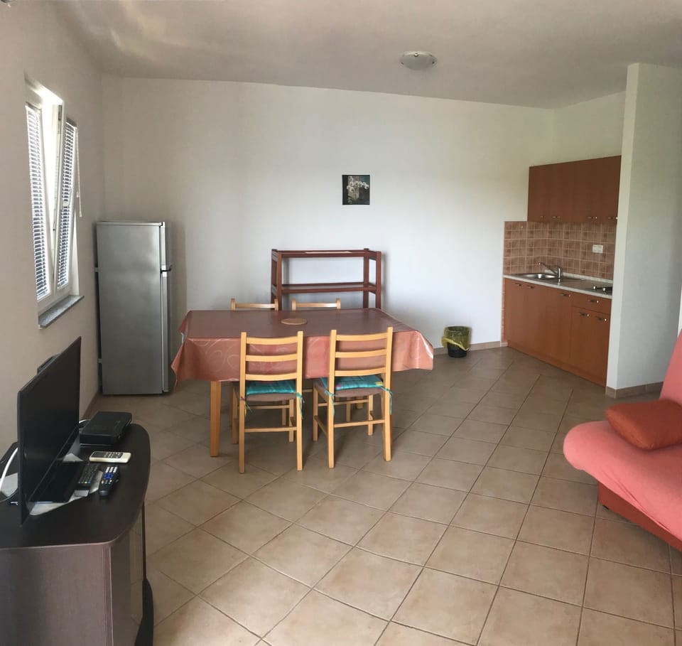 Classic Apartment, Sea View | Living area | TV