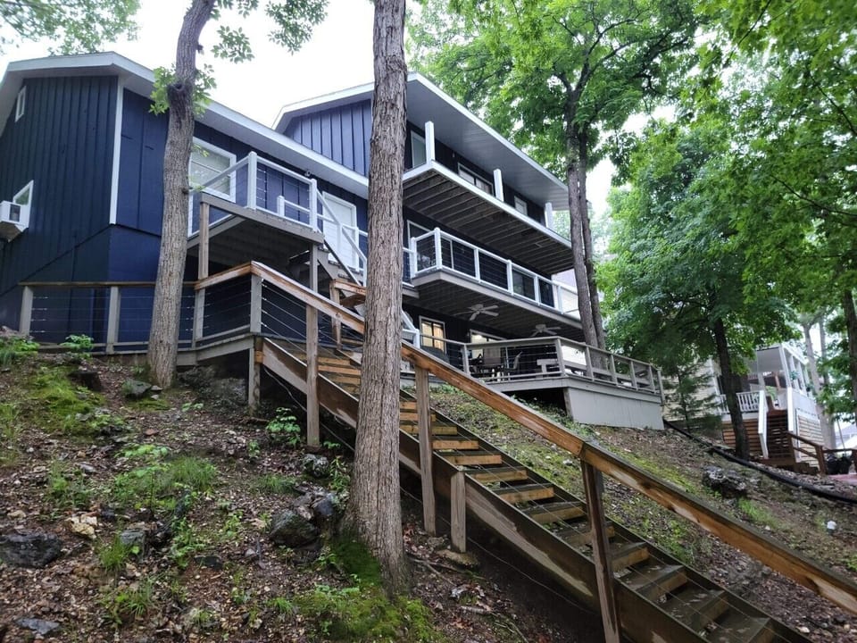 The rear of the house looking up from the steps going to the dock.