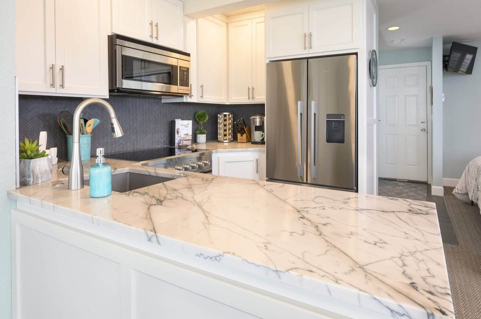 Kitchen counter detail w/ polished stone & thoughtful finishes