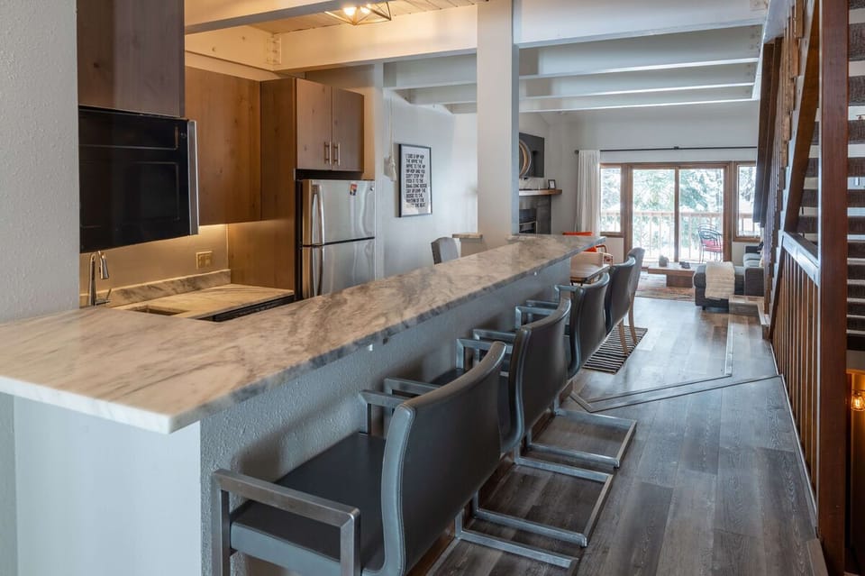 Seating for four at the breakfast bar looking into the kitchen