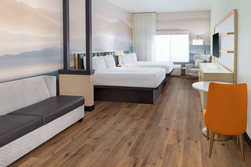 Junior suite two queens non smoking | Living area | 37-inch LCD TV with cable channels, TV, pay movies