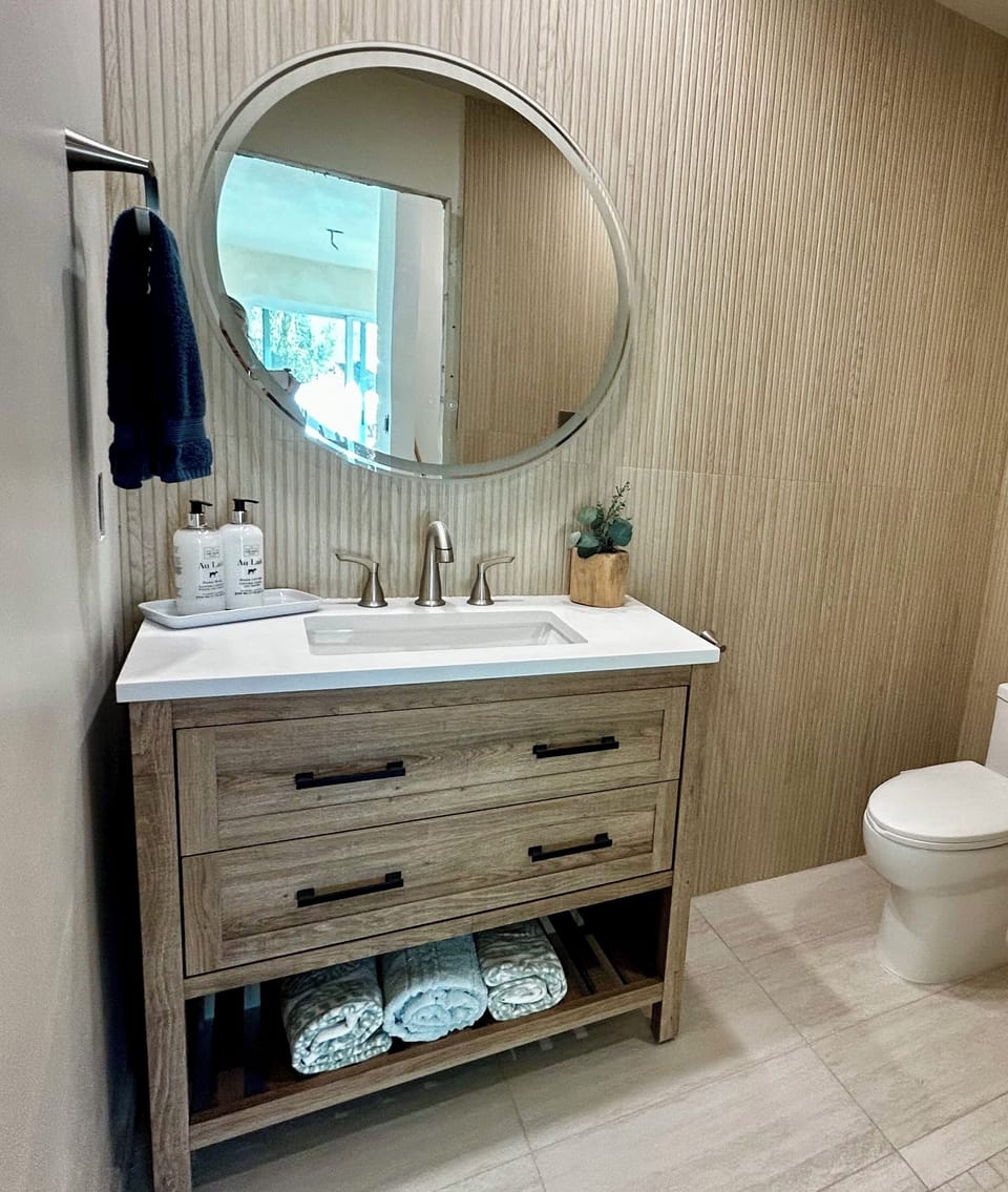Full bathroom with shower off primary bedroom