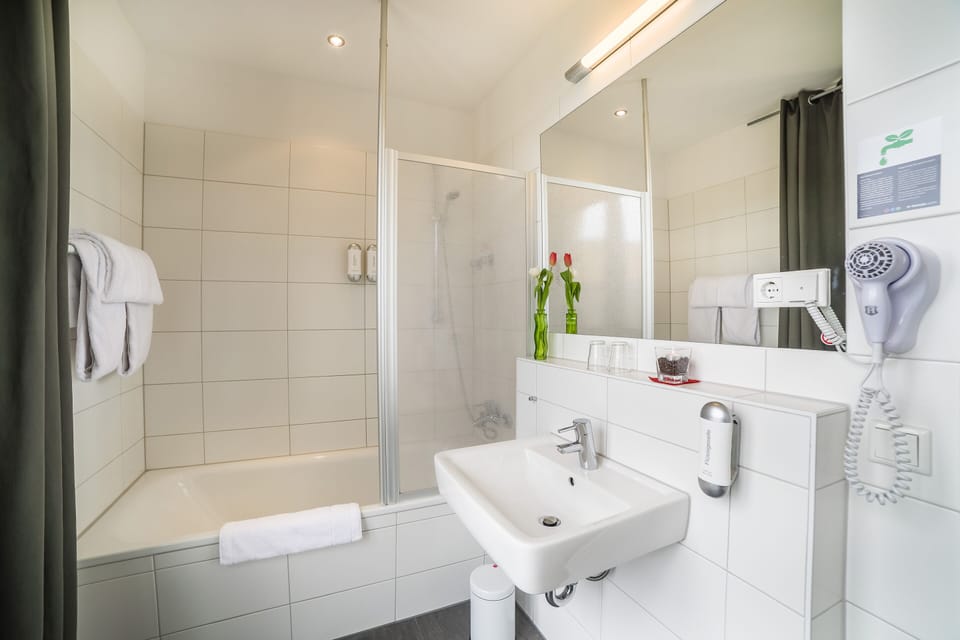 Bathtub, hair dryer, towels