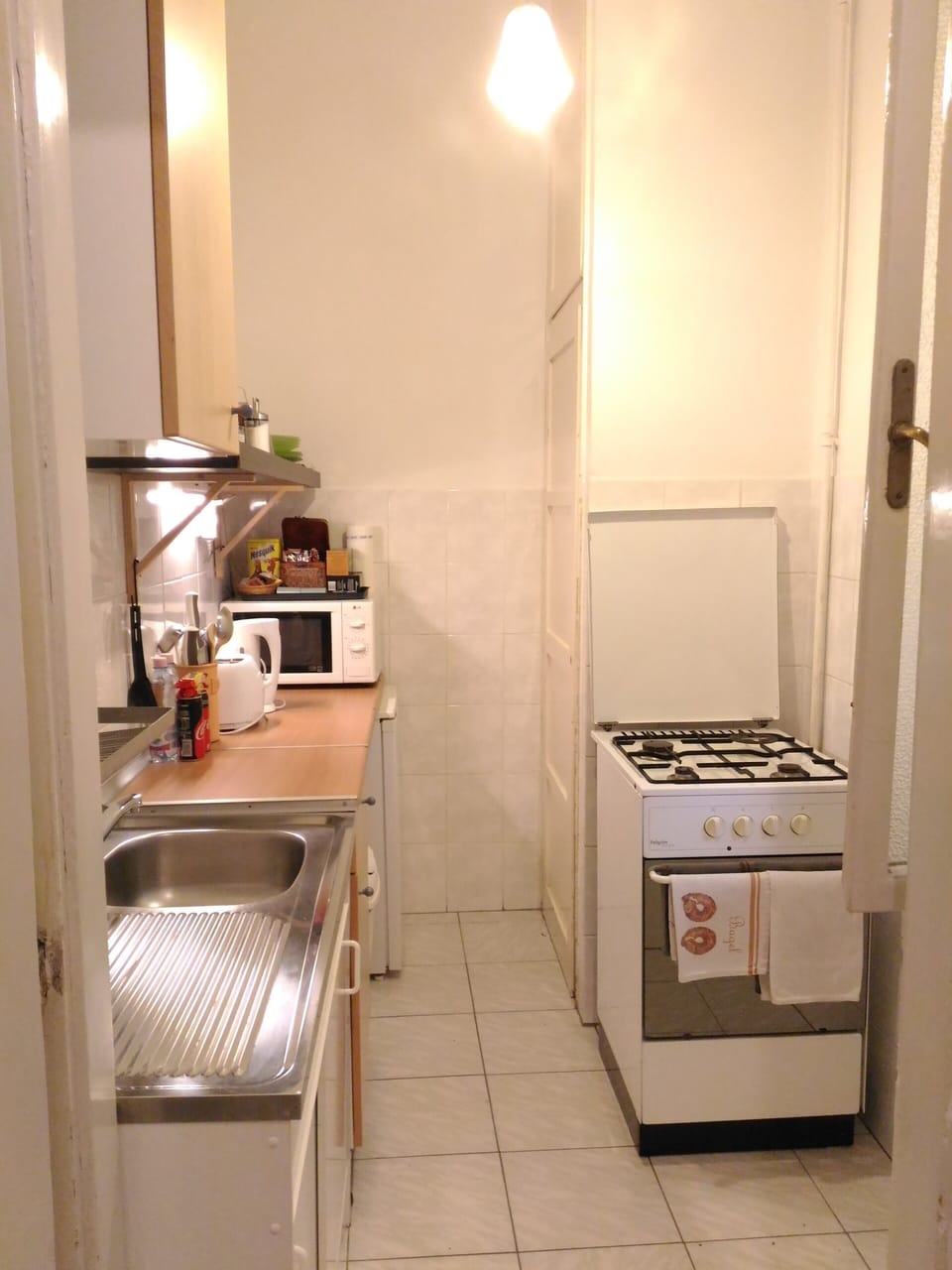 kitchen with fridge , freezer, micro, gas stove, toaster , coffee maker , kettle