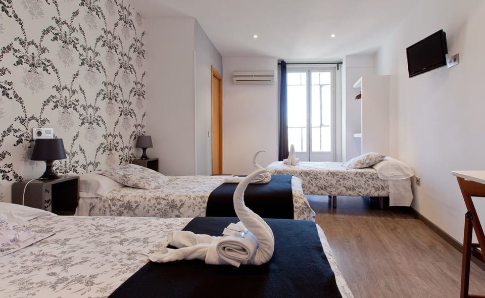 Triple Room, Private Bathroom | Blackout drapes, soundproofing, iron/ironing board, free WiFi