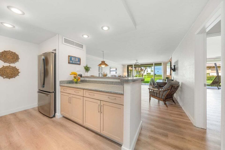 Open-concept layout flows seamlessly into the kitchen and dining area