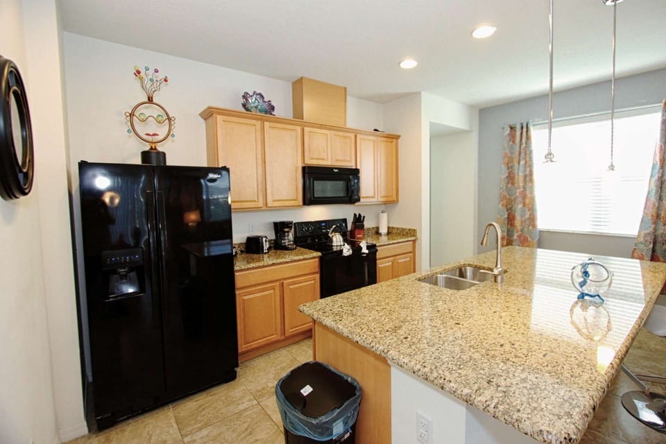 Modern Kitchen w/Stainless Steel Appliances and Granite Counter Tops - View #2