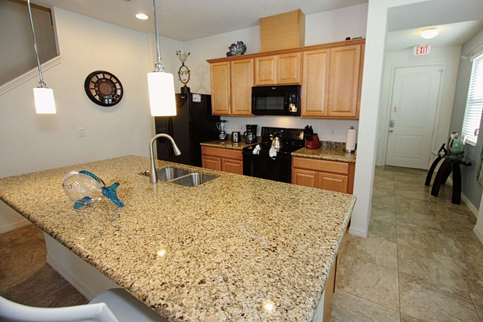 Modern Kitchen w/Stainless Steel Appliances and Granite Counter Tops