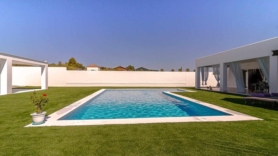 Property building,Garden,Pool view,Swimming pool