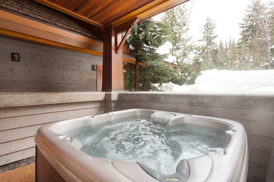 - Private hot tub surrounded by snow and evergreen mountain views  
- Unwind in bubbling warmth after an exhilarating day on the slopes  
- Covered deck ensures year-round relaxation in alpine tranquility  
