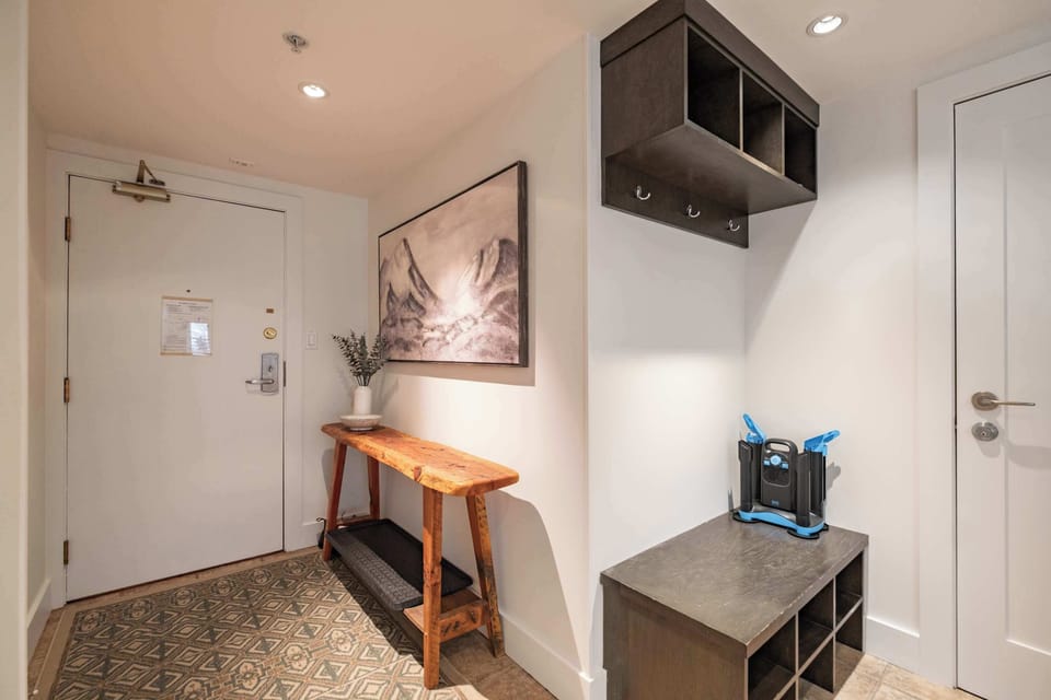 - Warm entryway with ski storage and wooden accents - Whistler condo designed for comfort and convenience - Drop your gear and relax after your mountain day