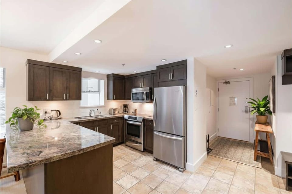 - Fully equipped modern kitchen with granite counters - Stainless steel appliances and bar seating for dining - Ideal for family stays and extended Whistler vacations