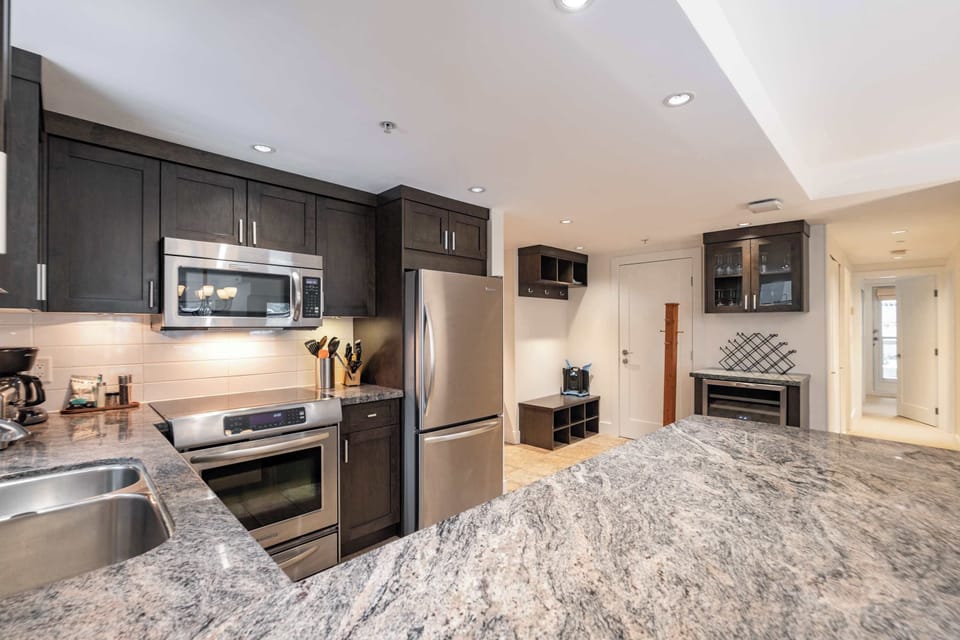 - Fully equipped kitchen with stainless steel appliances - Ample counter space for cooking your favorite meals - Modern Whistler unit with everything for your stay